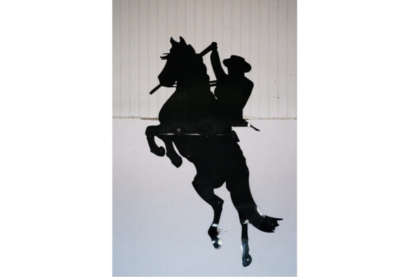 Dekorative Ausschnittform, in Form eines Cowboys auf einem Pferd